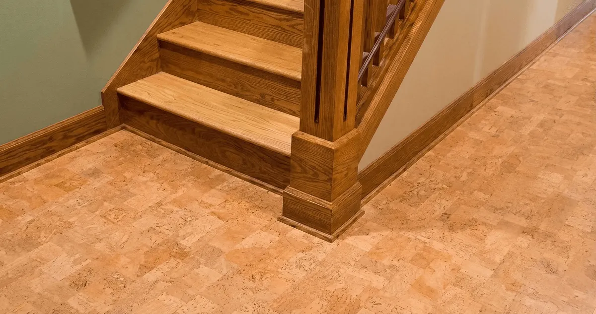 End of a staircase with cork flooring in Syracuse, NY
