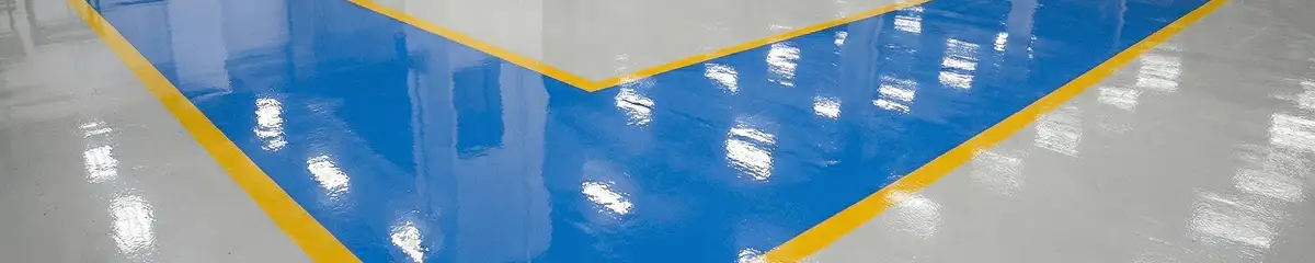 A factory floor professionally covered and marked with epoxy flooring in Syracuse, NY