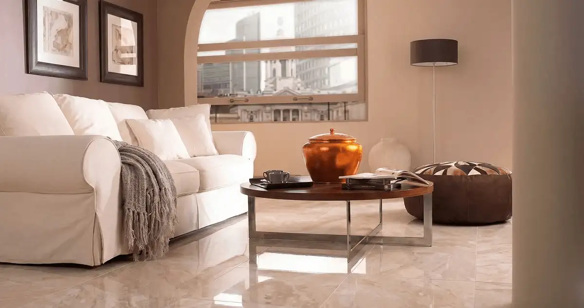 Modern living room with professionally installed marble flooring, a beige sofa, coffee table in Syracuse, NY