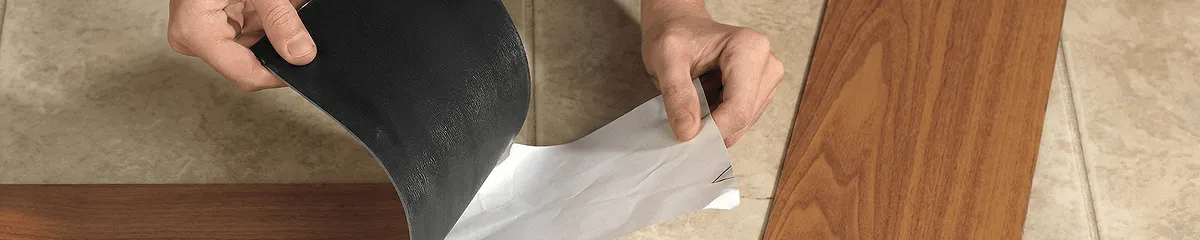 A professional installing vinyl flooring in Syracuse, NY